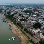 BRAZIL. Aerial view of Itaituba, a city known for intense gold mining activity in the Tapajós River valley.